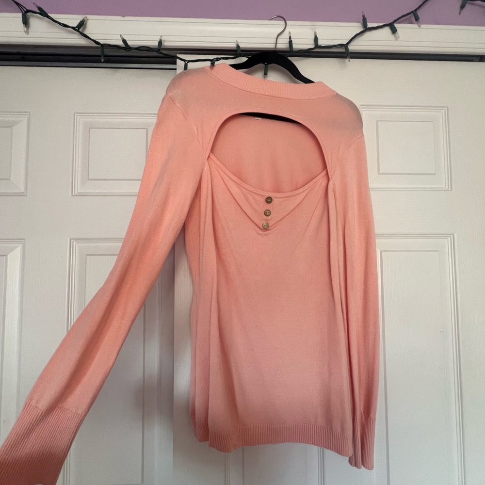 Pink sweater with chest cutout